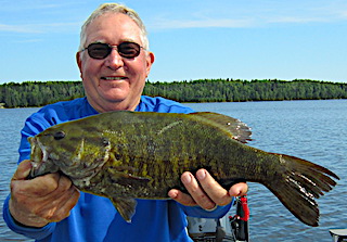 Trophy Smallmouth Bass Fishing is Great at Fireside Lodge by Jim